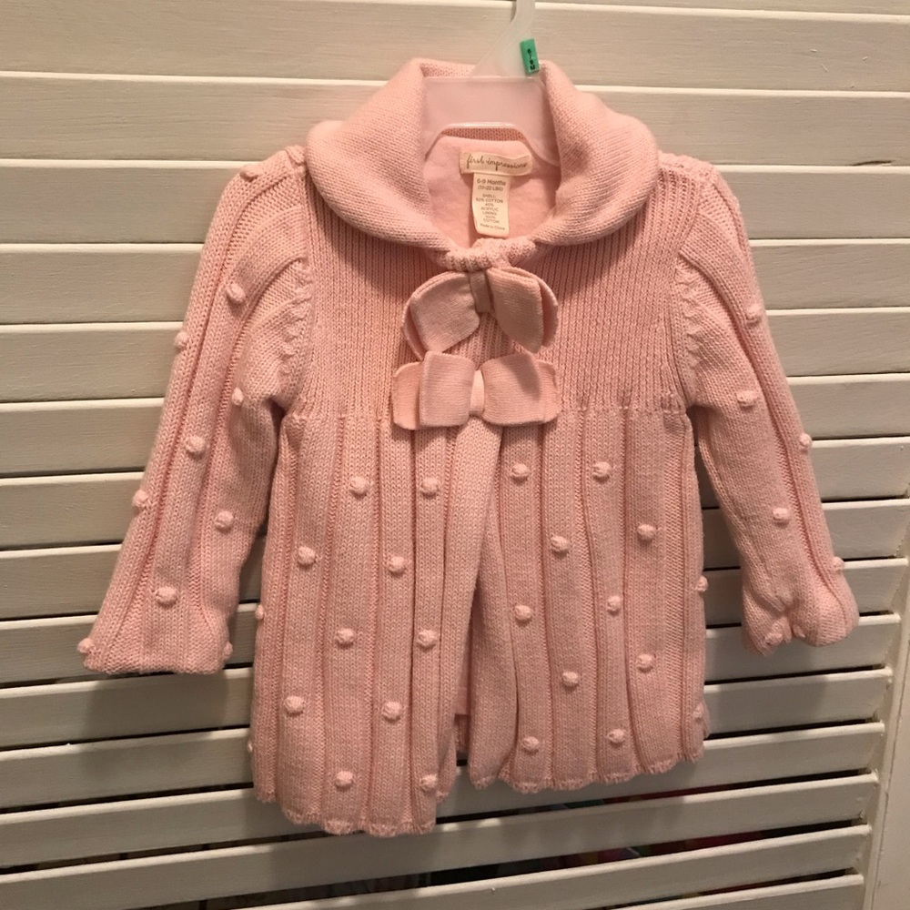 Adorable baby girl sweater, light pink.